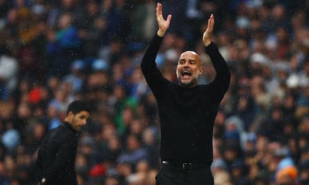 Pep Guardiola and Mikel Arteta on the touchline at the Etihad Stadium.