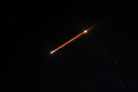 An Iranian missile with cluster munitions flies over Jerusalem on Friday.