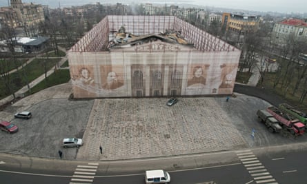 A view shows a fenced theatre building destroyed in the course of Russia-Ukraine conflict in Mariupol, 24 December 2022