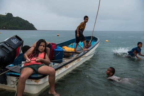 children on boats in Kioa