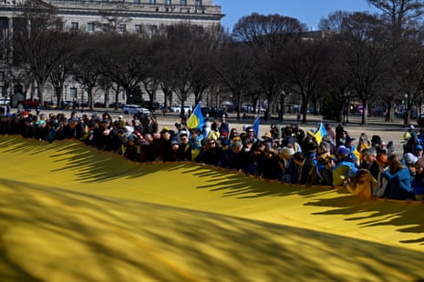 Demonstrators hold a massive Ukrainian flag as they rally in support of Ukraine during a protest on the Ellipse near the White House in Washington DC, US, on Friday.
