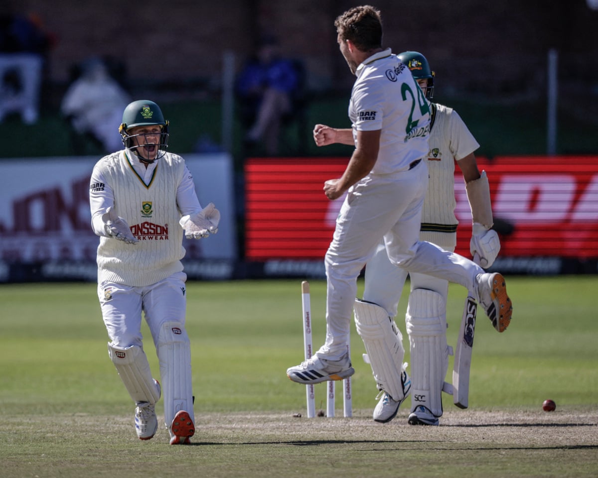 The South African bowler Wiaan Mulder celebrates with his wicketkeeper, Ryan Rickelton, after dismissing Australia's Scott Boland on the final day of the second Test in Gqeberha.