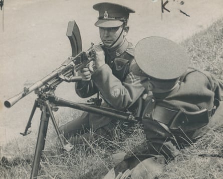 Soldiers test a machine gun in a field