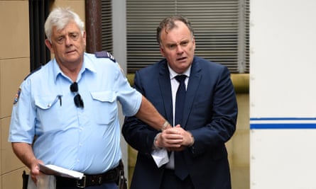 Glen McNamara is escorted by a correctional services officer as he leaves the NSW supreme court in Sydney in February 2016.