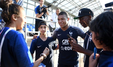 Kylian Mbappé poses with young fans from the Paris commune of Bondy at the end of a World Cup training session in Moscow. 