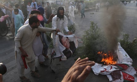 Islamists burn a portrait of Pakistan’s prime minister Imran Khan after the supreme court overturned Asia Bibi’s sentence.