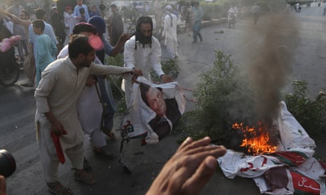 Protesters burn pictures of the Pakistan prime minister, Imran Khan, in Karachi last week