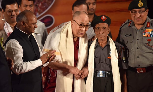 The Dalai Lama shakes hands with Naren Chandra Das