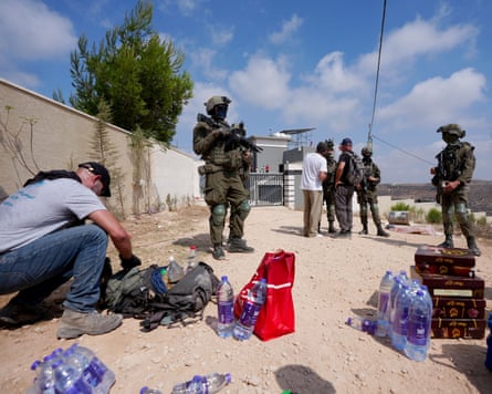 Activists trying to deliver basic supplies to three Palestinian families under siege by settlers in Qusra