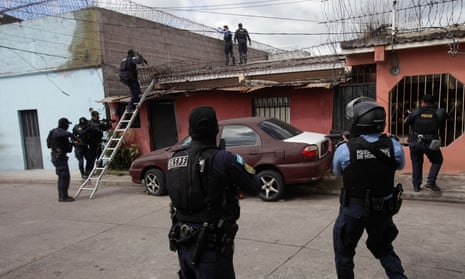 Police raid a house in Tegucigalpa, Honduras, on 8 December. 