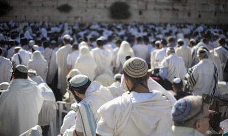 Jewish men pray at the Western Wall.
