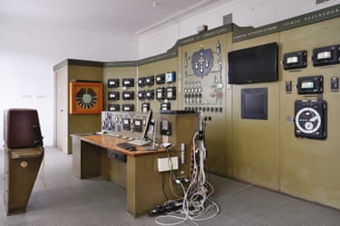 Olive green wall-length structure and standalone control panel