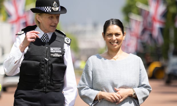 Priti Patel walks with deputy assistant commissioner Barbara Gray, who is leading the policing operation around the platinum jubilee