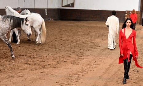 Models and dappled greys on the sand of the École Militaire riding school in Paris