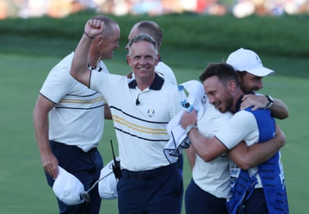 Europe captain Luke Donald celebrates after Tyrrell Hatton halves his match on the 18th hole during the singles to win the Ryder Cup.