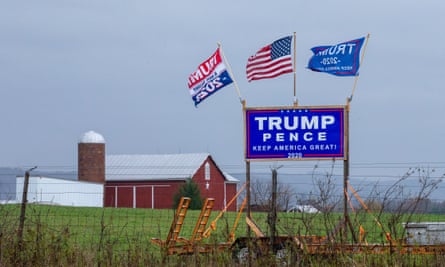 A Trump-Pence re-election sign and flags are displayed in rural central Pennsylvania. People of similar political allegiance tend to cluster together even at the neighborhood level.