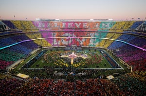 Fans spell out a message during the half-time show at Super Bowl 50