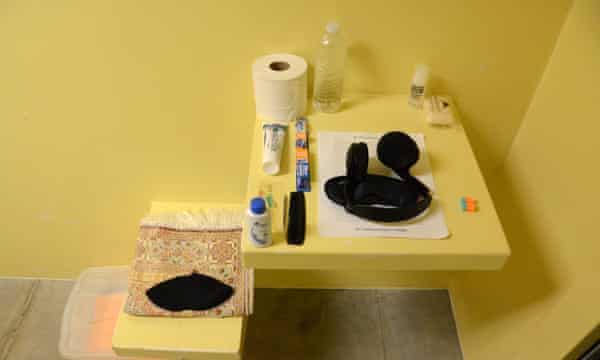 GTMO Guantanamo Bay camp and prison February 2016 Camp Six - a cell with prayer mat and a detainee’s personal belongings