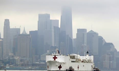 The Navy hospital ship USNS Comfort passes lower Manhattan on its way to docking in New York, Monday, March 30, 2020. The ship has 1,000 beds and 12 operating rooms that could be up and running within 24 hours of its arrival on Monday morning. It’s expected to bolster a besieged health care system by treating non-coronavirus patients while hospitals treat people with COVID-19. (AP Photo/Seth Wenig)