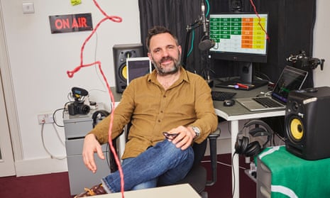 Shaun Keaveny in his cramped studio in Soho, with a red wire hanging down