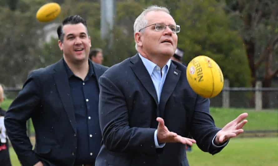 Prime Minister Scott Morrison catches a ball at Norwood Sports Club on Day 34 of the 2022 federal election campaign, in Norwood in Melbourne, in the seat of Deakin. Saturday, May 14, 2022. (AAP Image/Mick Tsikas)