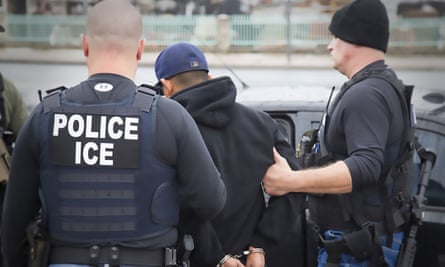 Ice officers arrest a suspect during a raid in Los Angeles.