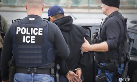US Immigration and Customs Enforcement officers detain a suspect during an enforcement operation on 7 February in Los Angeles, California.