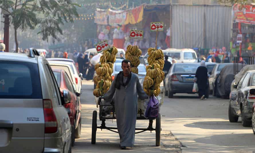 A street vendor selling bananas close to a market in Cairo.