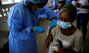 A medical worker administers a booster dose of the Pfizer-BioNTech Covid vaccine at the El Chorrillo health centre in Panama City.