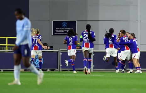 Tara Elimbi Gilbert is embraced by her PSG teammates after scoring a late equaliser