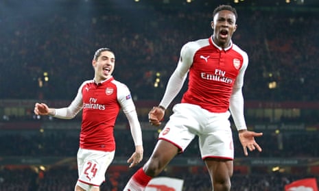 Arsenal’s Danny Welbeck celebrates his second and Arsenal’s third against Milan as Héctor Bellerín watches on.
