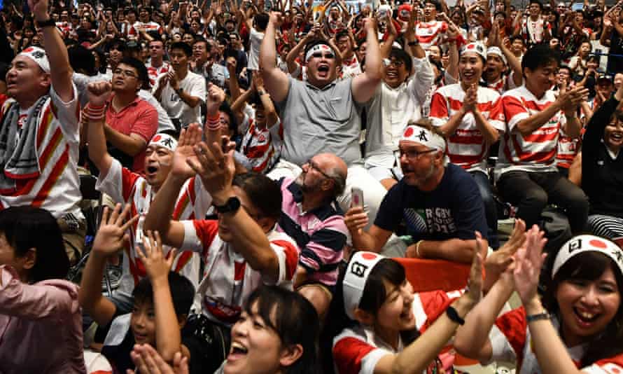 Fans enjoy Japan’s victory over Scotland.