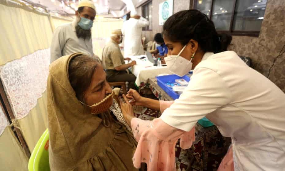 A Covid-19 vaccine shot being administered in Bhopal, India