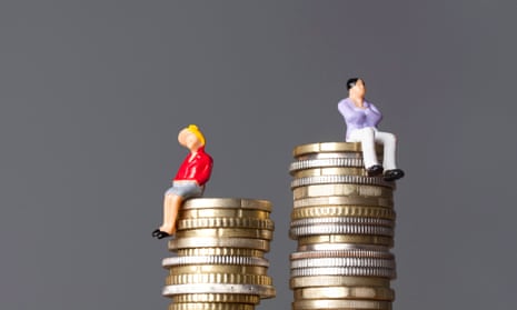 small dolls sitting on unequally stacked coins