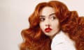 Hannah Platt posing with bouffant red hair and a stylised nosebleed that meets her red lipstick