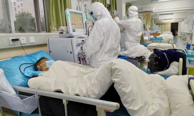 Medical staff at Central Hospital in Wuhan treat patients. On Saturday a 62-year-old doctor in the city died after treating coronavirus patients.