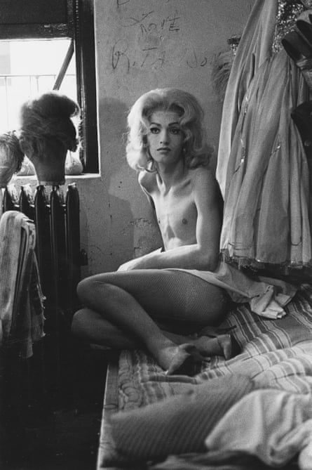Female impersonator on bed, NYC, 1961.