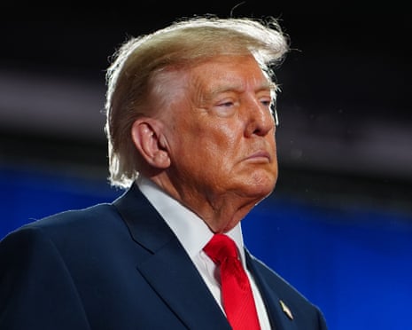 Man in suit at political rally