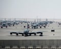 Military aircraft lined up on a runway