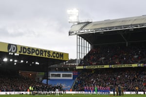 Members of both sides hold a minutes silence prior to kick-off.