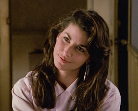 She tilts her her head and smiles gently