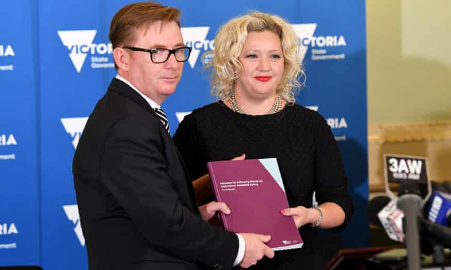 Former Australian Medical Association head Brian Owen hands over a report to Victorian health minister Jill Hennessy after the Ministerial Advisory Panel on Voluntary Assisted Dying released its final findings. 