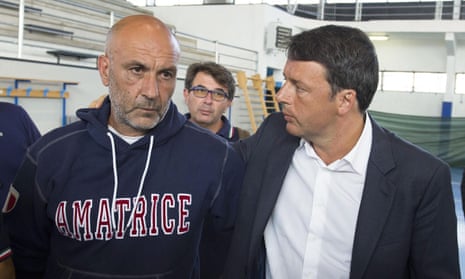 Italian premier Matteo Renzi talks to the mayor of Amatrice Sergio Pirozzi on a visit to the earthquake-hit town.