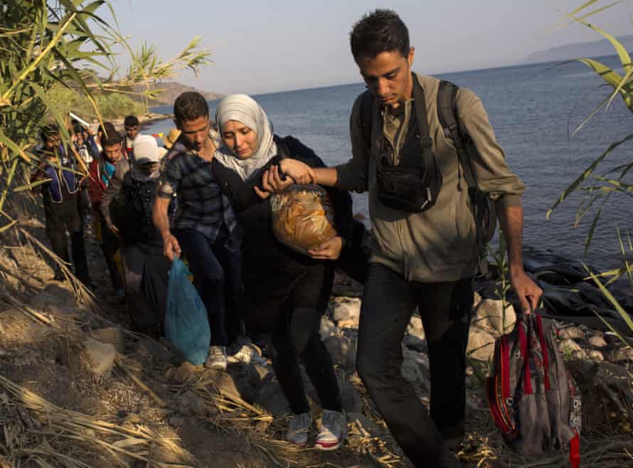 Migrants from Syria and Afghanistan arrive on the Greek island of Lesbos.
