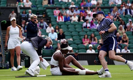Venus Williams takes a fall during her match against Elina Svitolina on day one of the 2023 Wimbledon Championships
