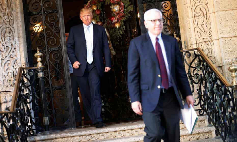 Donald Trump watches from the door as David Rubenstein leaves following a meeting at Mar-a-lago in December 2016.