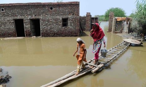  A temporary walkway by a flooded house in Shikarpur, Sindh province. 