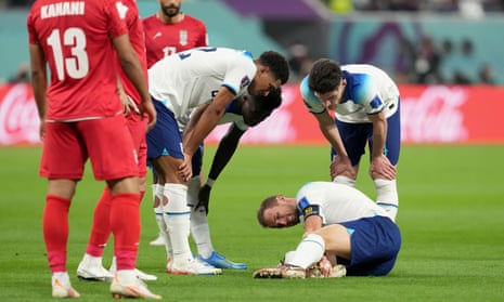 Harry Kane clutches his foot after a heavy tackle during England’s 6-2 win against Iran