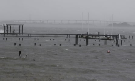 The Emerald Isle bridge is seen in the distance past the flooded docks in Bogue Sound on 13 September.