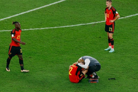 A tearful Toby Alderweireld is consoled by Thierry Henry at the final whistle.